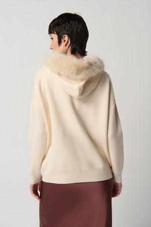 Joseph Ribkoff Sweater With Faux Fur Hood And Pompoms