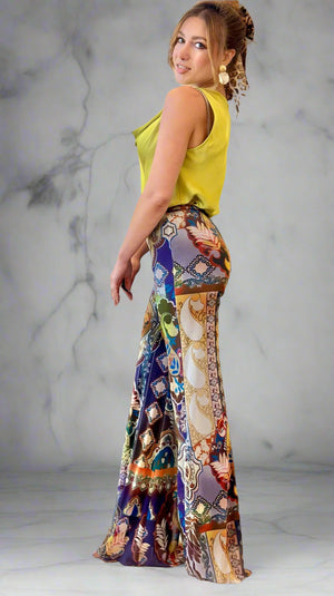 Woman in a colorful dress standing in a living room.